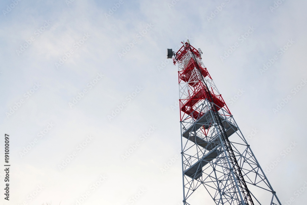 Transmitters and aerials on telecommunication tower, sunset in snowy country Transmitters and aerials on telecommunication tower, sunset in snowy country