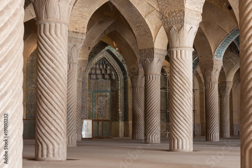 Columns of Nasir al-Mulk Mosque in Shiraz, Iran. Old iranian mosque doors. Entrance to the big islamic building. Masjid columns. Iranian mosque doors. Version 2. photo