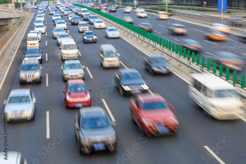 Motion blurred car driving on crowded city road in Beijing,China © ABCDstock
