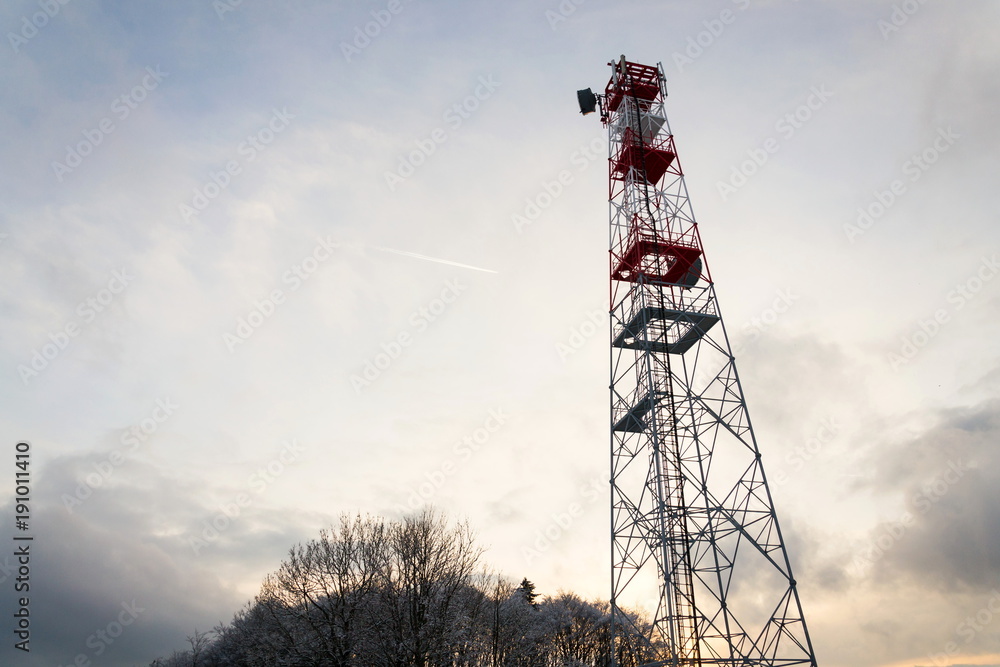 Εκτύπωση καμβά Transmitters and aerials on telecommunication tower, sunset in snowy country