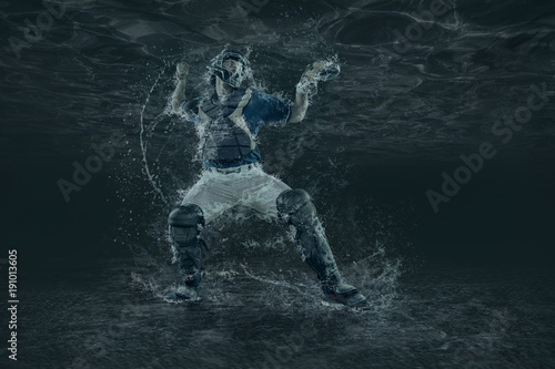 Baseball players in action under water