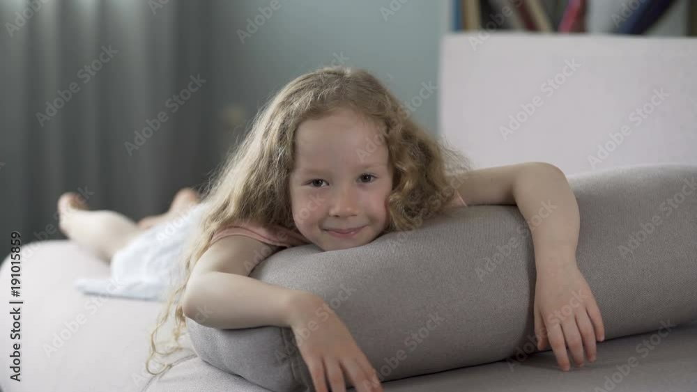Happy healthy little girl looking at camera with smile on face, happy childhood Happy healthy little girl looking at camera with smile on face, happy childhood