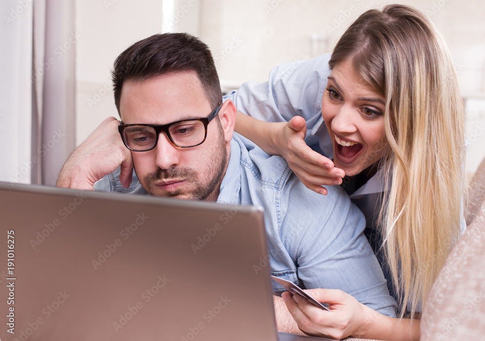 Couple shopping online at home Couple shopping online at home