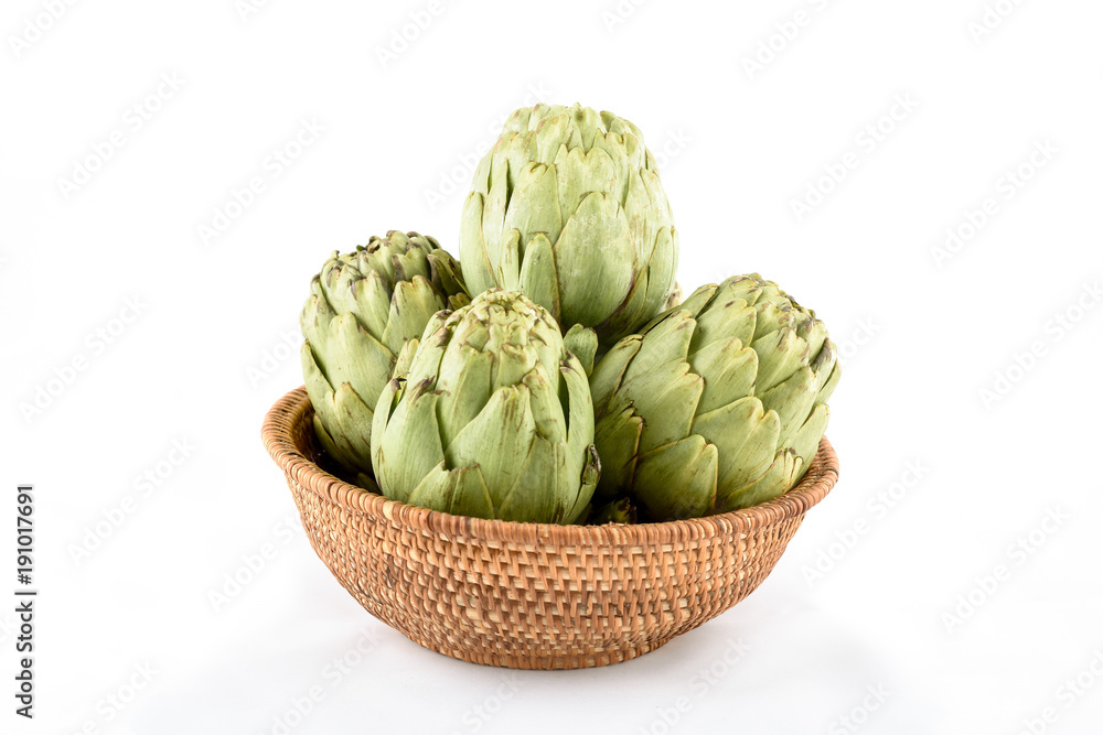 Fototapeta premium artichokes in basket on white background