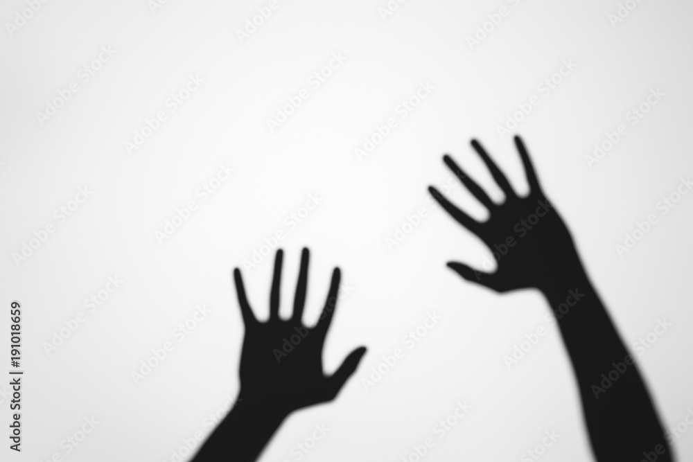 spooky mysterious shadows of human hands on grey spooky mysterious shadows of human hands on grey