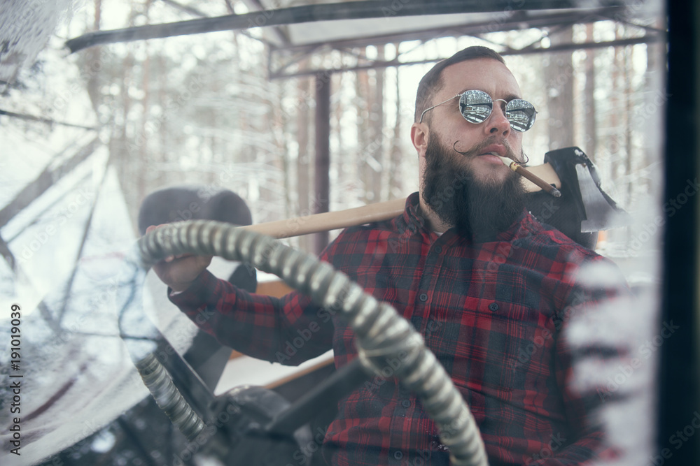 Bearded man in car