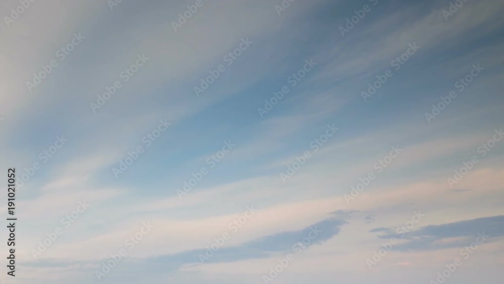 Russia, time lapse. Formation and rapid movement of white clouds of different shapes in the blue sky in late spring at sunset. Russia, time lapse. Formation and rapid movement of white clouds of different shapes in the blue sky in late spring at sunset.
