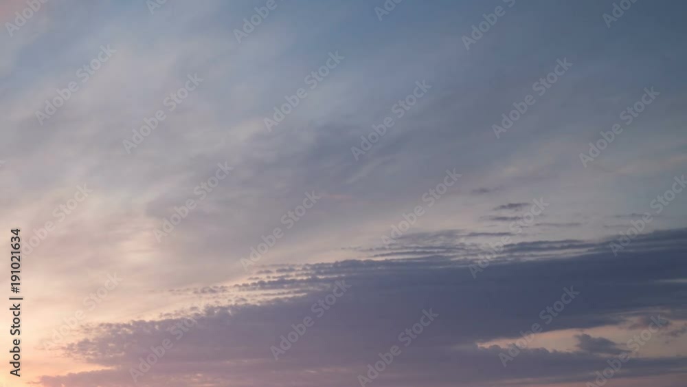 Russia, time lapse. Formation and rapid movement of white clouds of different shapes in the blue sky in late spring at sunset. Russia, time lapse. Formation and rapid movement of white clouds of different shapes in the blue sky in late spring at sunset.