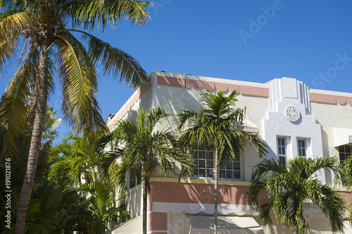 Close-up detail of typical colorful 1930s Art Deco architecture with palm tree in Miami, Florida