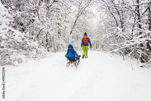 Kid on the sleigh.