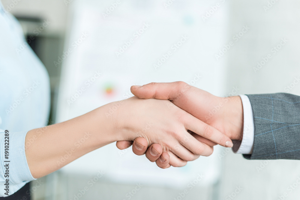 cropped shot of businesspeople shaking hands cropped shot of businesspeople shaking hands