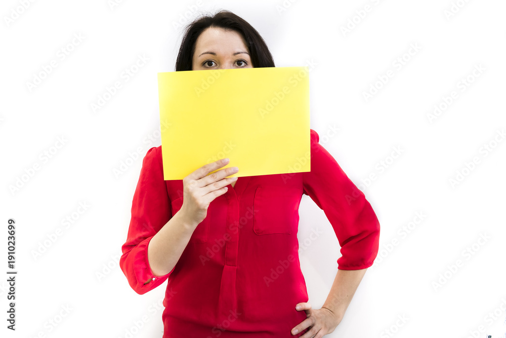 Anonymous business woman. Pretty slim girl holding a blank sheet for the inscriptions, studio photo isolated Anonymous business woman. Pretty slim girl holding a blank sheet for the inscriptions, studio photo isolated