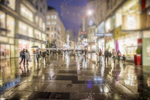 Fototapeta Naklejka Na Ścianę i Meble -  people walking on rainy night streets