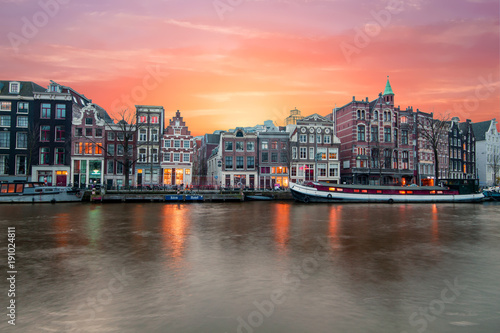 Amsterdam at the river Amstel at sunset in the Netherlands photo