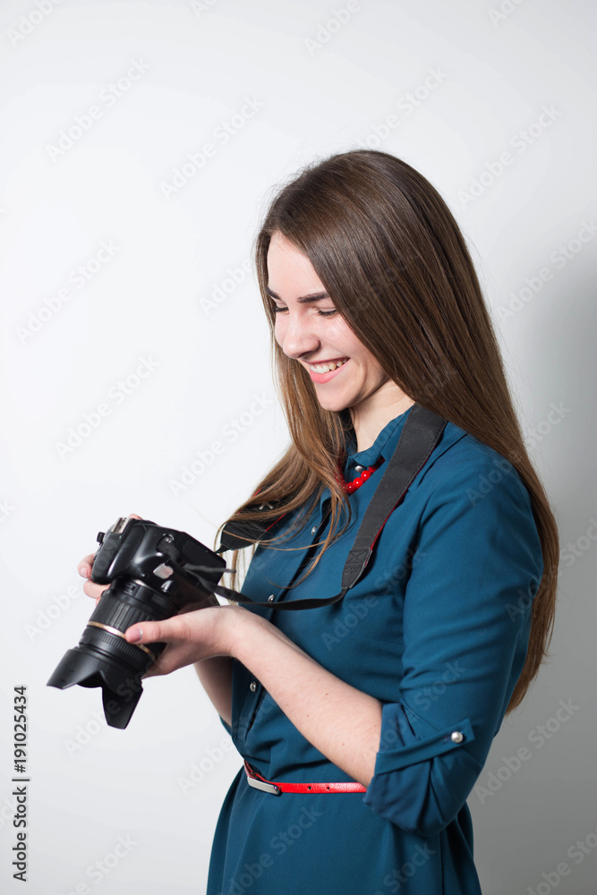 girl photographer on a white background