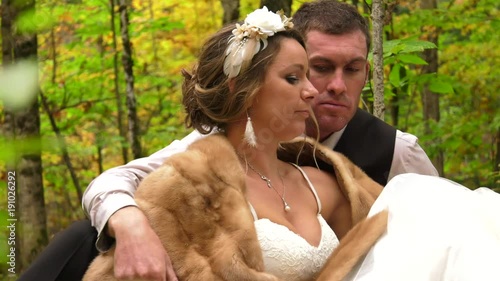 newly weds get comfortable in the forest floor 4k photo