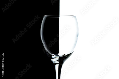 Canvastavla empty glass of wine on black and white backgrounds.