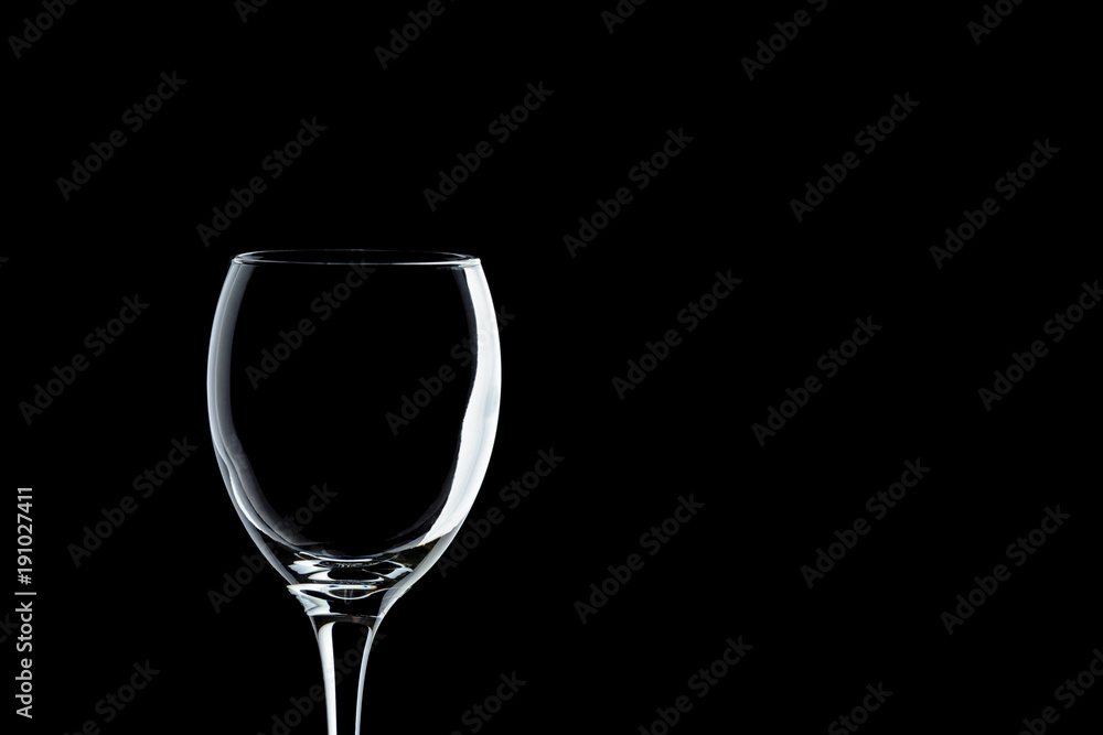 a glass of wine close-up on a black background (isolate).
