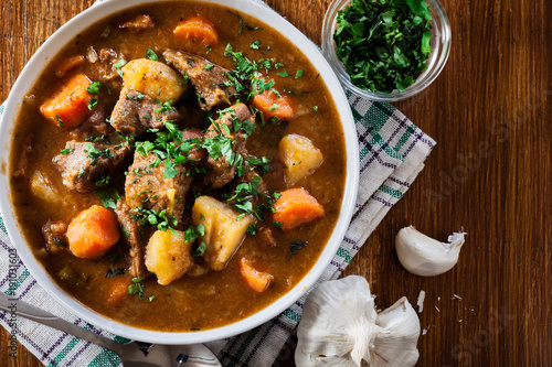 Irish stew made with beef, potatoes, carrots and herbs photo