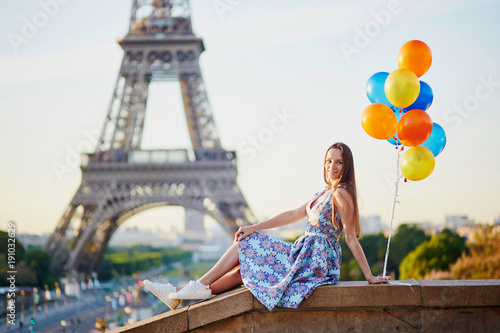 Young woman with bunch of balloons near the Eiffel tower © Ekaterina Pokrovsky