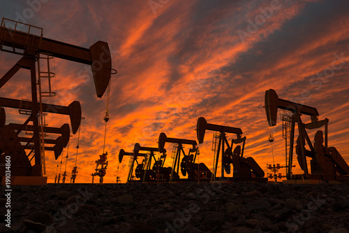 3D render of pump jacks in an oil field photo