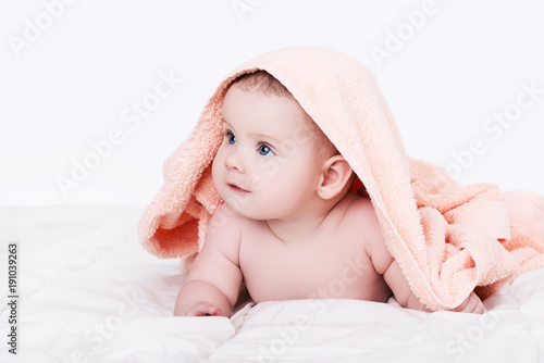 Baby girl or boy after shower with towel on head, isolated