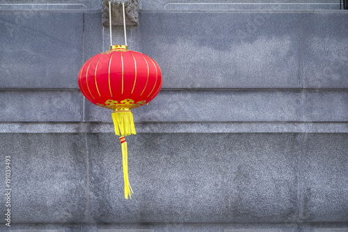 Chinese red lantern in a Thai-Chinese temple on grey background as an up-coming Chinese new year celebrate decoration with blank side copy space.