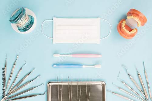 dentist tools and orthodontic on color background, flat lay, top vipw. photo