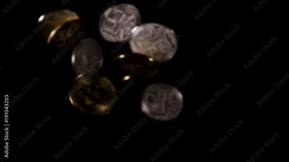 Several gold and silver bitcoins are flying down slow mo Several gold and silver bitcoins are flying down slow mo