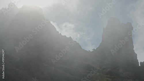 Very foggy rocks with lightrays coming through.