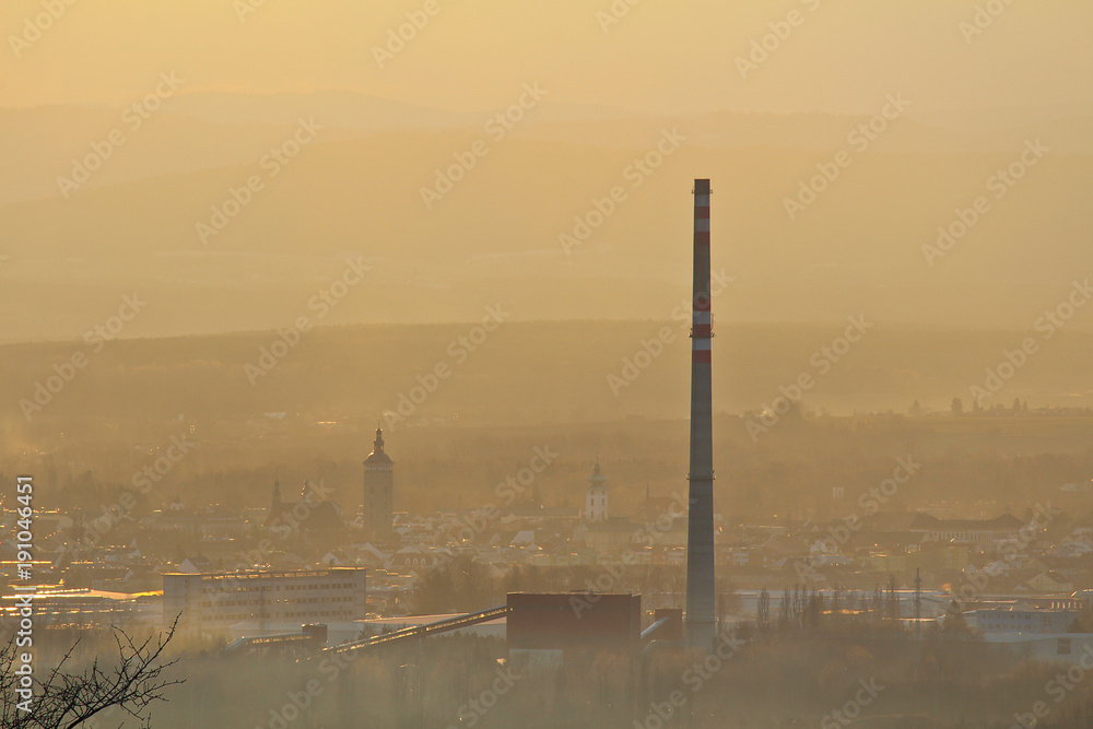 Centre of city Ceske Budejovice in winter sunset and fog