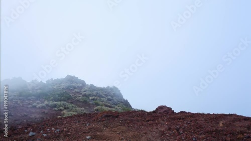 Time lapse of fog in valley in between mountains.