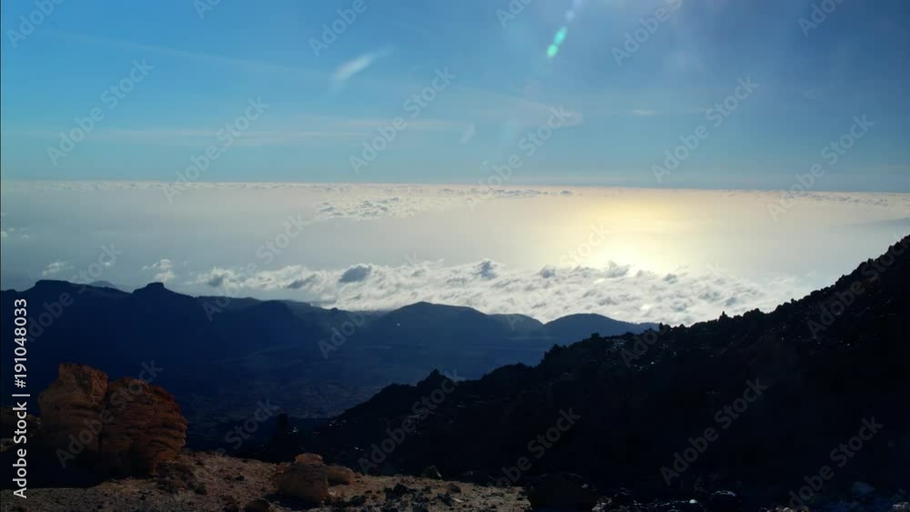 Clouds over the sea covering part oClouds over the sea covering part of the mountains of an island.f the mountains of an island. Clouds over the sea covering part oClouds over the sea covering part of the mountains of an island.f the mountains of an island.