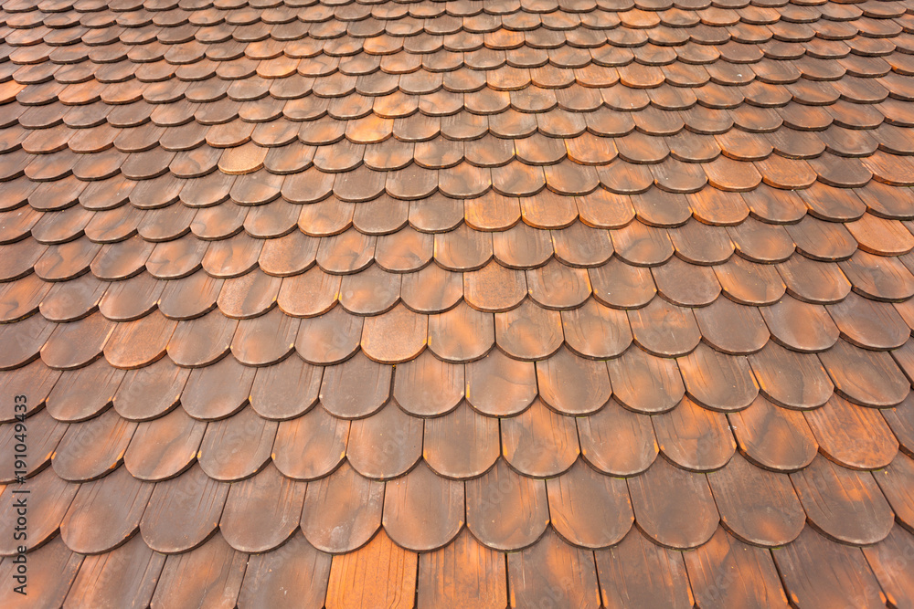 detail of  a tiled roof from a mountain house in Val di Funes (Italy)