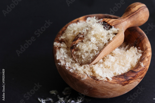 The gellant agent agar-agar seaweed in wooden bowl copy space