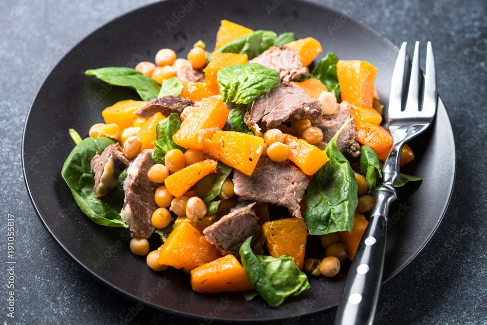 Warm salad with pumpkin, baked beef, spinach and chickpeas. Warm salad with pumpkin, baked beef, spinach and chickpeas.