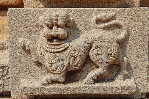 Stone bas-reliefs on the walls around the Vittala Temple in Hampi, Karnataka, India.