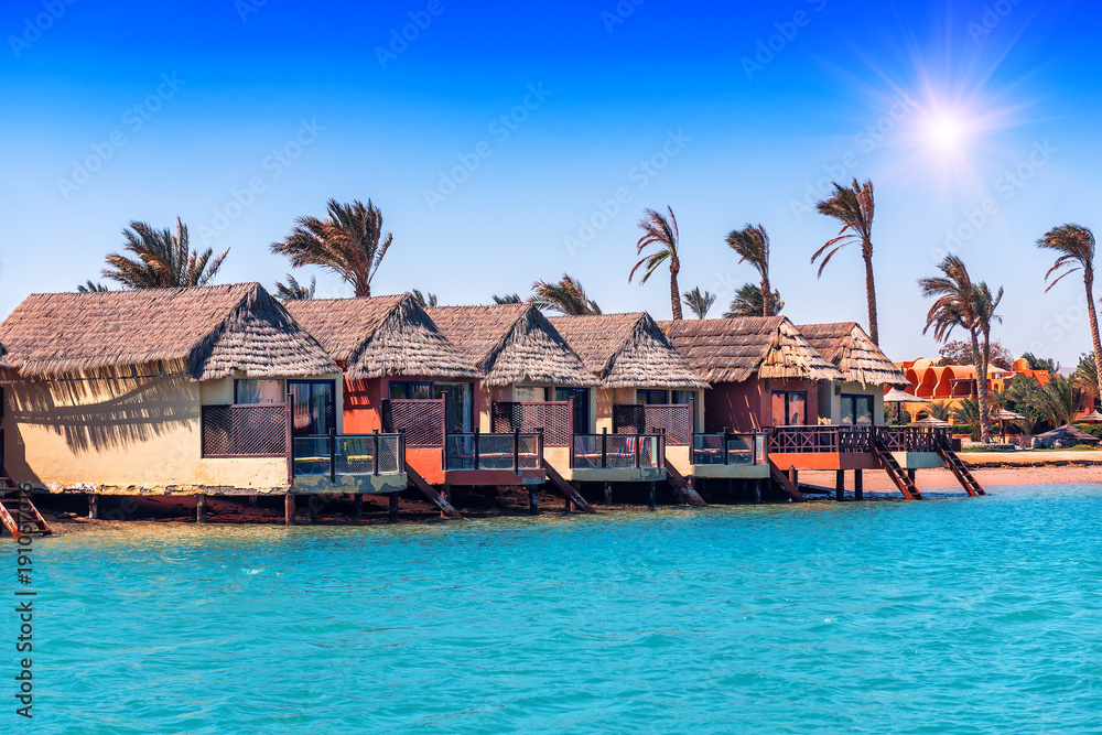 Row of bungalows near the water Row of bungalows near the water
