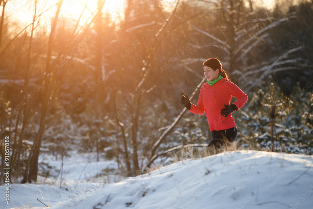 Image of running sports girl in winter forest at morning