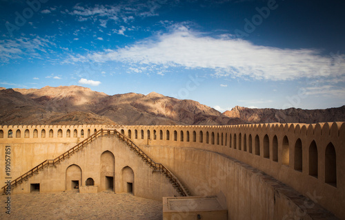 Stunning view of the Nizwa fort surrounded by mountains (Ad Dakhiliyah, Oman)