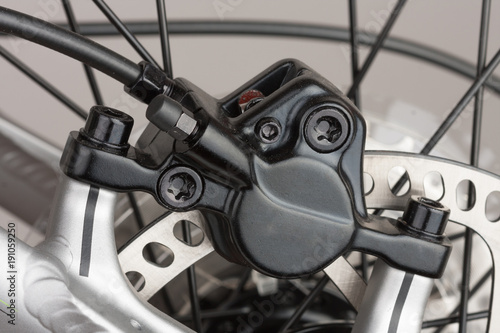 Hydraulic rear disc brake of mountain bike, close up view, studio photo