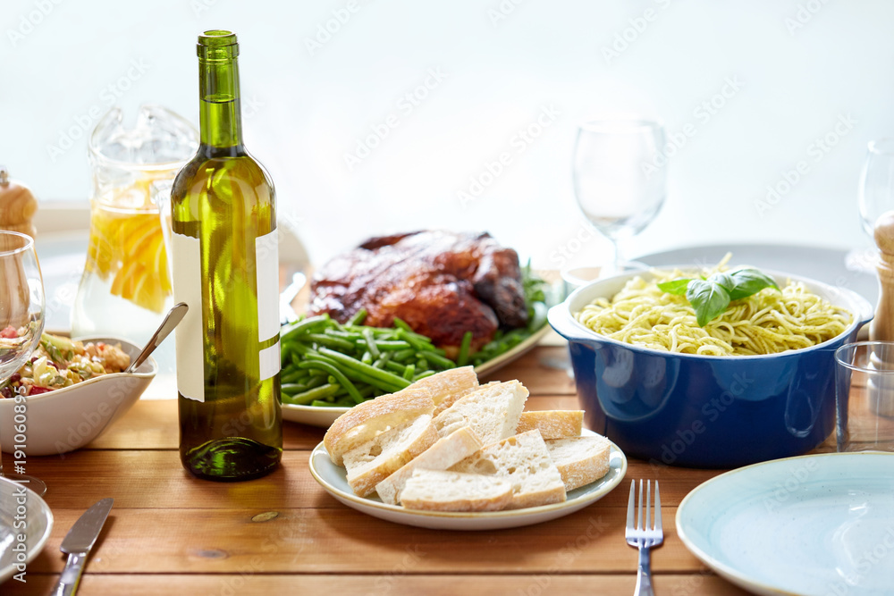 bottle of wine and food on served wooden table bottle of wine and food on served wooden table