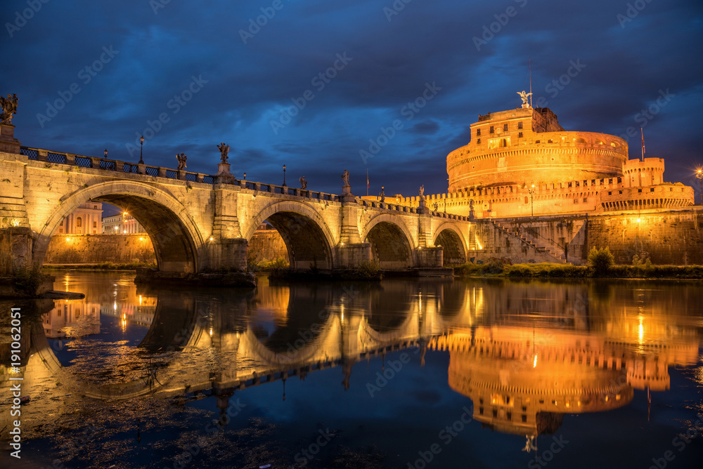 Beautiful night view of Saint Angel Castle and bridge over the Tiber river in Rome, Italy