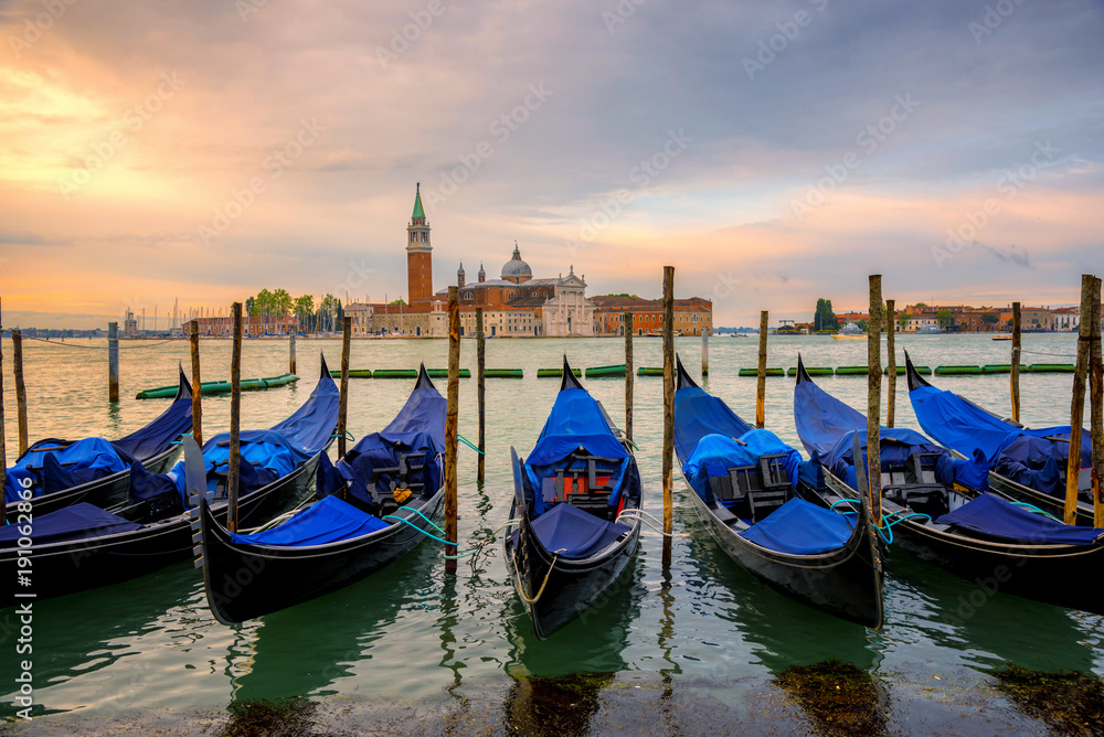 Sunrise landscape view of gondola and building in early morning with no people no tourist as beautiful amazing view and attraction in venice , Italy