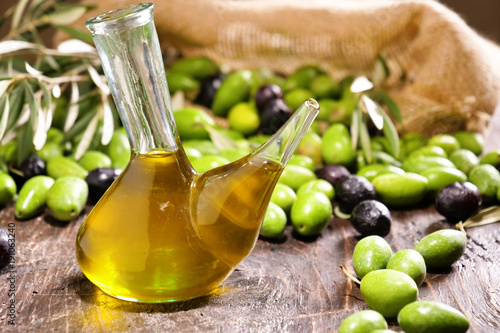 Genuine Italian olives organic oil cold pressed falls. concept of nature and healthy food, healthy and natural. fresh olives and Tuscan Italian oil