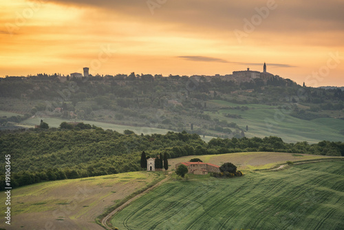 Tuscany landscape at sunrise with a little chapel of Madonna di Vitaleta, San Quirico d'Orcia, Italy