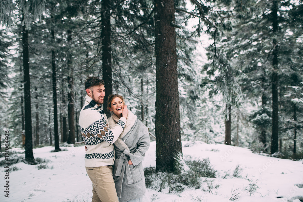 Photo of happy man and woman outdoor in winter