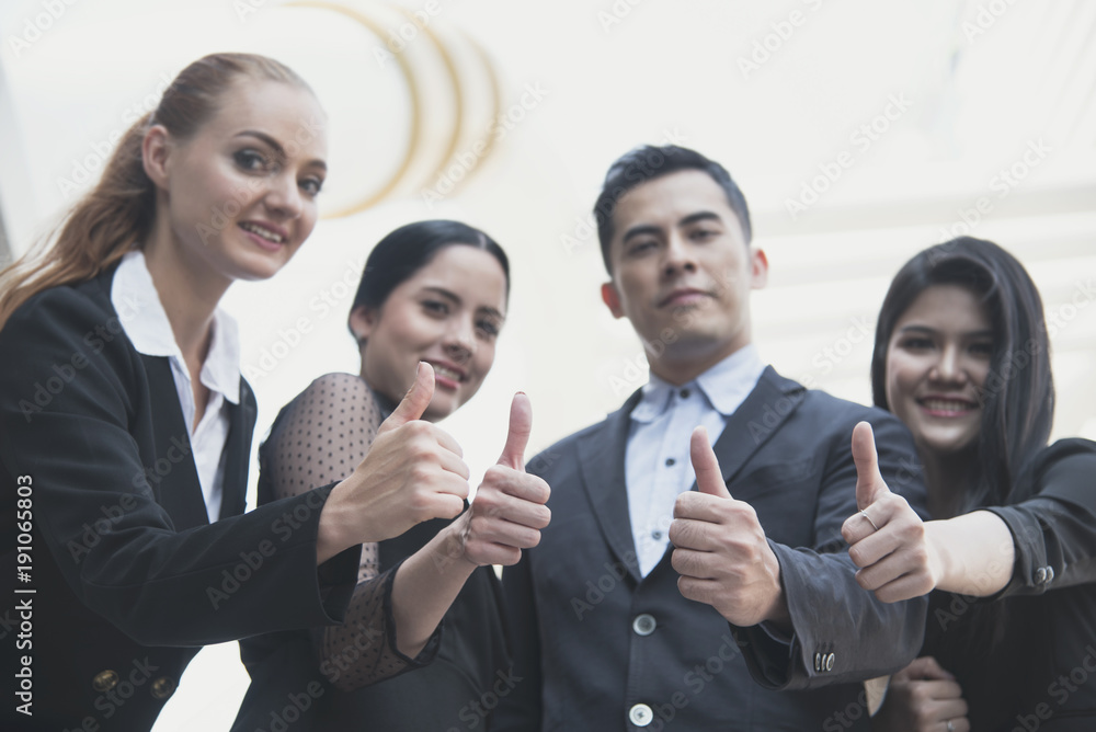 young people thumbs up together. concept teamwork and success. young people thumbs up together. concept teamwork and success.