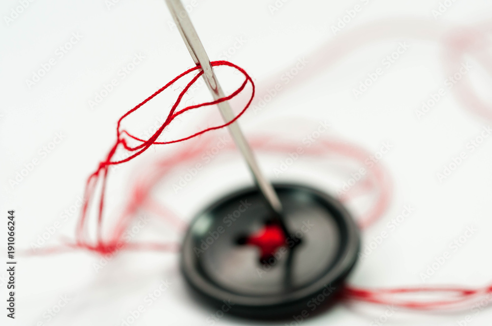 Needle and thread and buttons hi-res stock photography and images