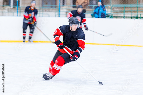 Ice hockey player with stick in attack. Ice hockey game